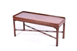 A Georgian Chippendale style mahogany coffee table. Having gallery edge and pierced stretcher.