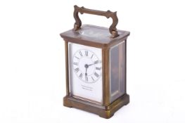 A brass carriage clock by Furber & Son, Cheltenham.