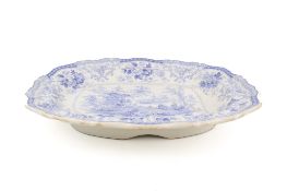 A large 19th century stone china meat dish with reservoir.