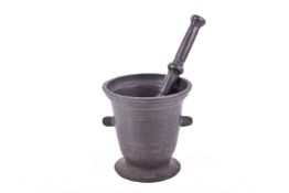 A 18th century cast bronze pestle and mortar.