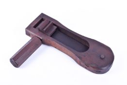 A stained wood military rattle. With octagonal handle, impressed date 1944, L31cm.