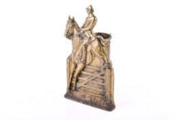 A brass fire iron's tools stand with horse rider decoration.