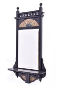 A late 19th century ebonised pier mirror.