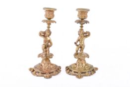 A pair of 19th century or later French gilt bronze candlesticks.
