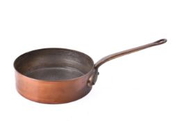A Leon Jaeggi & Sons heavy brass and copper saucepan.