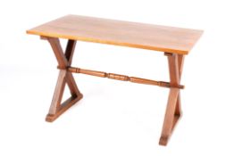 An early 20th Century Arts & Crafts, light oak X frame writing table.