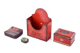 A collection of assorted wax seals with three advertising tins and a leaf holder.