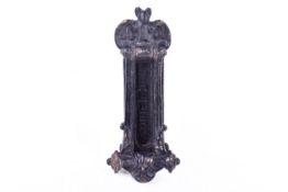 A Gothic style black painted cast iron door knocker letter box.