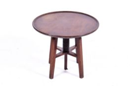 A 19th century mahogany revolving wine or sculpture table.