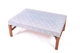 A 20th century Georgian style ottoman stool.