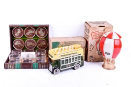Mid-century novelty decanters (boxed) and a set of drinking glasses.