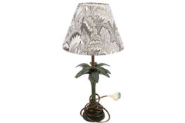 A contemporary table lamp modelled as a palm tree. Raised on a circular base.