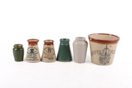 A Maypole Dairy 2lb jug and five cream pots. Including two Somerset examples.