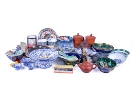 A collection of assorted modern Oriental related items. Including tea pots, fans, etc.