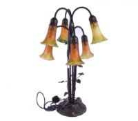 An Art Nouveau, Tiffany style lamp of tulip flower form.
