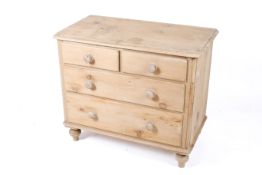A vintage pine chest of drawers.