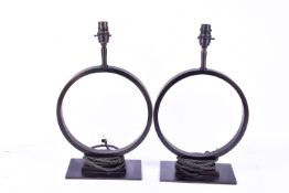 A pair of Pooky Smaller Oriel table lamps. Raised on rectangular metal bases.
