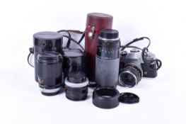 A vintage Canon FTb SLR film camera and four lenses outfit. S/n 648770 with Fd 35mm 1:3.