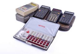 Three vintage scientific calculators. Including a HP.