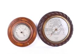 Two mahogany cased aneroid barometers.