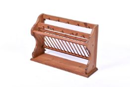 A pine kitchen wall mounted plate and cup rack.