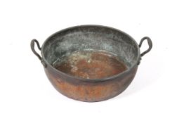 A large Victorian copper twin handled preserving pan.