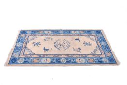 A Chinese style wool rug (AF).