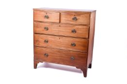 An Edwardian mahogany chest of drawers. Having two short over three long graduated drawers.
