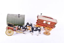 Two scratch built models of travellers' vardos caravans, with two painted brass horses.