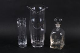 A group of three assorted contemporary glassware items.