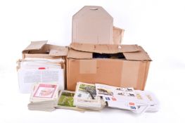 A collection of assorted first day covers and stamp related post cards
