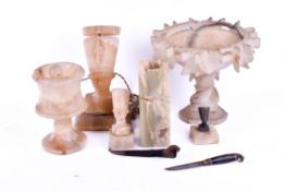 A group of assorted alabaster carved items. Including a pharaoh table lamp, centre piece, etc.