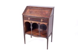 An Edwardian mahogany bureau in the manner of Leonard Wyburd for Liberty & Co.