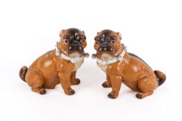 A pair of 19th century German 'Meissen' style porcelain pug dogs.
