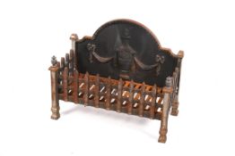 A wrought iron fire basket with ornate urn and swag casting to the back plate.
