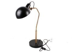 A contemporary adjustable Endon Largo satin brass and black table lamp. Raised on a circular base.