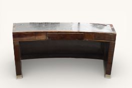 A late 20th century curved desk with inset leather top.