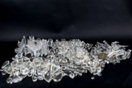 Collection of assorted crystal glass chandelier parts.