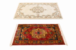 Two assorted wool rugs.
