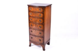 A 20th century Georgian style bow fronted chest of drawers.