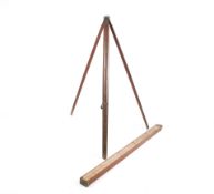 A large vintage wooden tripod and an 'A. Clarkson & Co.