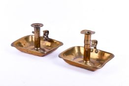 A pair of vintage brass chamber sticks. With candle height adjuster.