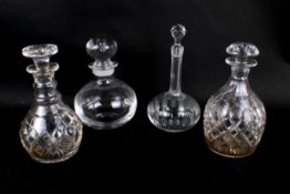 Four assorted glass decanters.