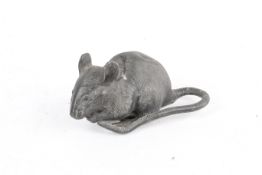 A Japanese cast metal figure modelled as a rat eating. H6.