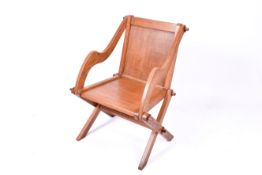 A 20th century oak Glastonbury chair.
