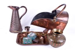 A group of assorted brass and copperware. Including a coal skuttle, a water pitcher, etc.