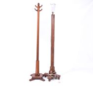 Two mid-century wooden items of furniture. Including a mahogany coat stand and an oak standard lamp.