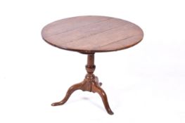 A Georgian oak tilt top table with tripod base.