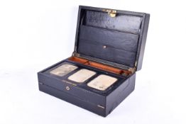 An early 2oth century Parkins & Gotto black leather writing slope.