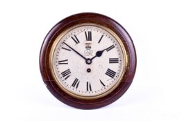 A mahogany cased 'GR VI' wall clock. Having 20cm diameter dial with Roman numerals, key present.